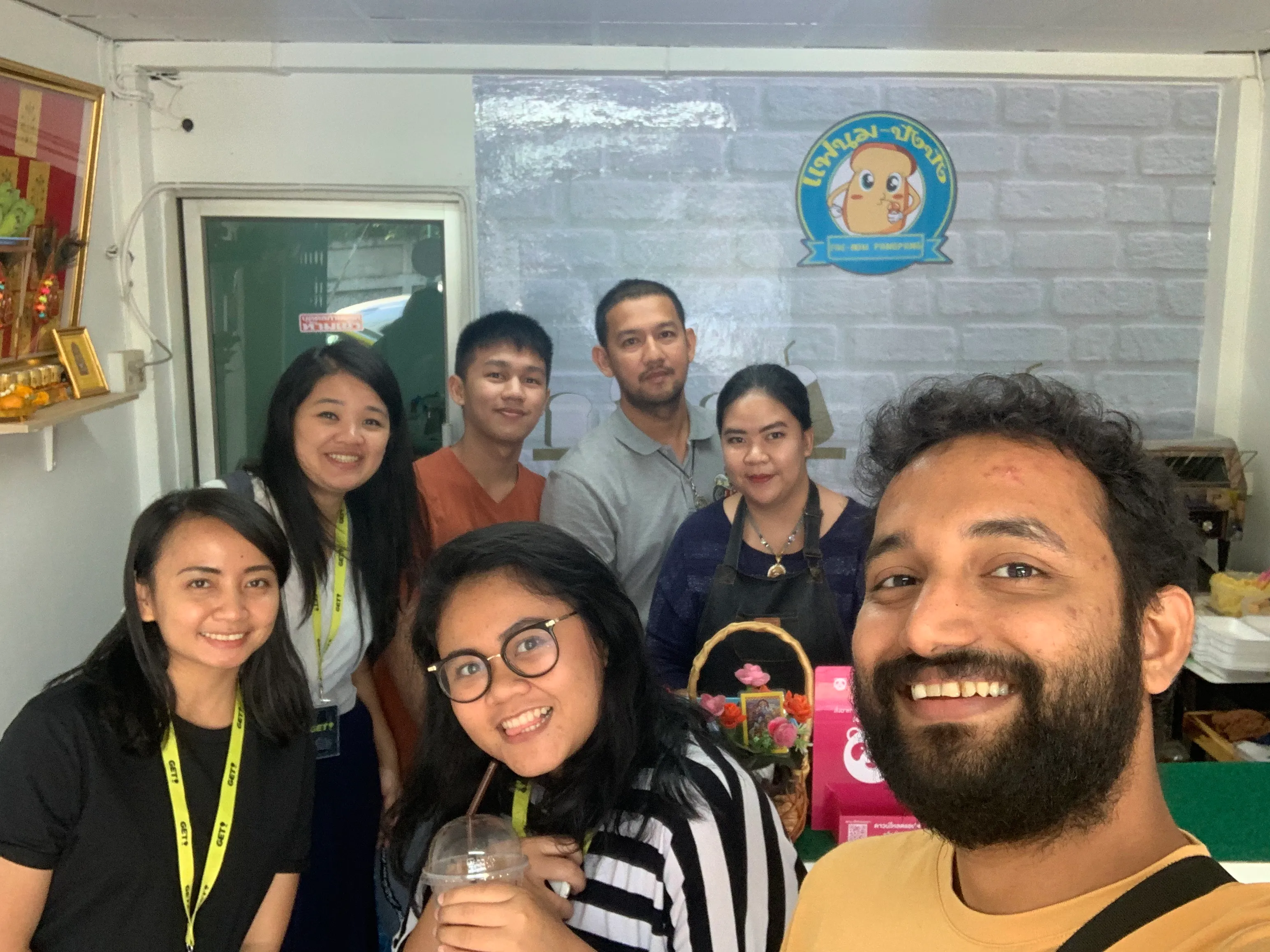 The Gojek research team with a restaurant owner in Bangkok