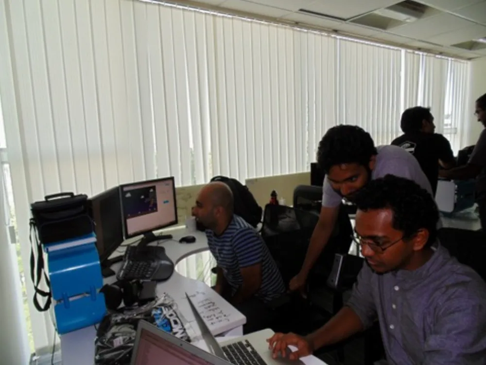 The Practo engineering team debugging together at their desks
